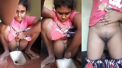 Tamil desi girl pissing in the bathroom