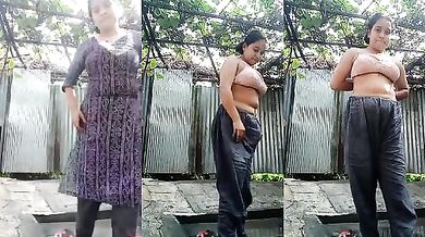 A Nagaland girl removes her dress before bathing